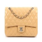 Chanel Classic Medium Shoulder Bag with diamond quilting, interlocking CC clasp, and adjustable chain strap for versatile elegance.