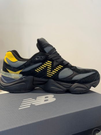 New Balance 9060 Men’s Sneakers in black and yellow featuring ABZORB cushioning, suede overlays, and a chunky midsole for a modern streetwear look.