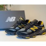 New Balance 9060 Men’s Sneakers in black and yellow featuring ABZORB cushioning, suede overlays, and a chunky midsole for a modern streetwear look.