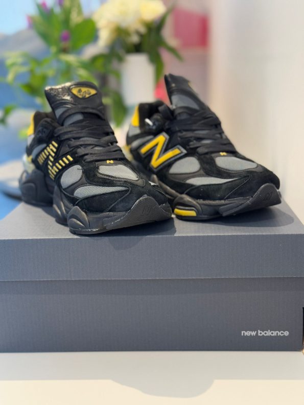 New Balance 9060 Men’s Sneakers in black and yellow featuring ABZORB cushioning, suede overlays, and a chunky midsole for a modern streetwear look.